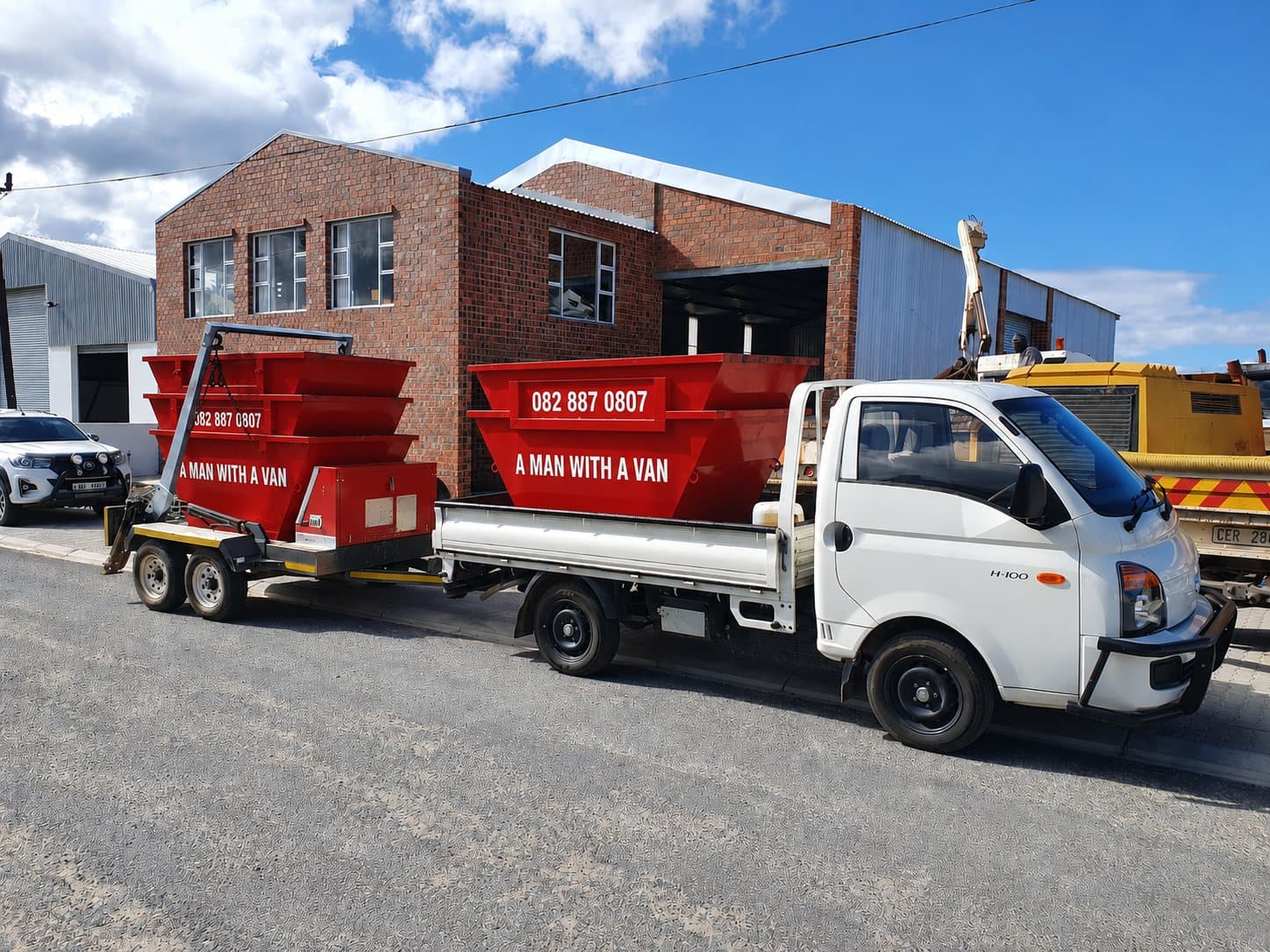 Cliff's truck and trailer loaded with skips, ready for a job in Gordon's Bay