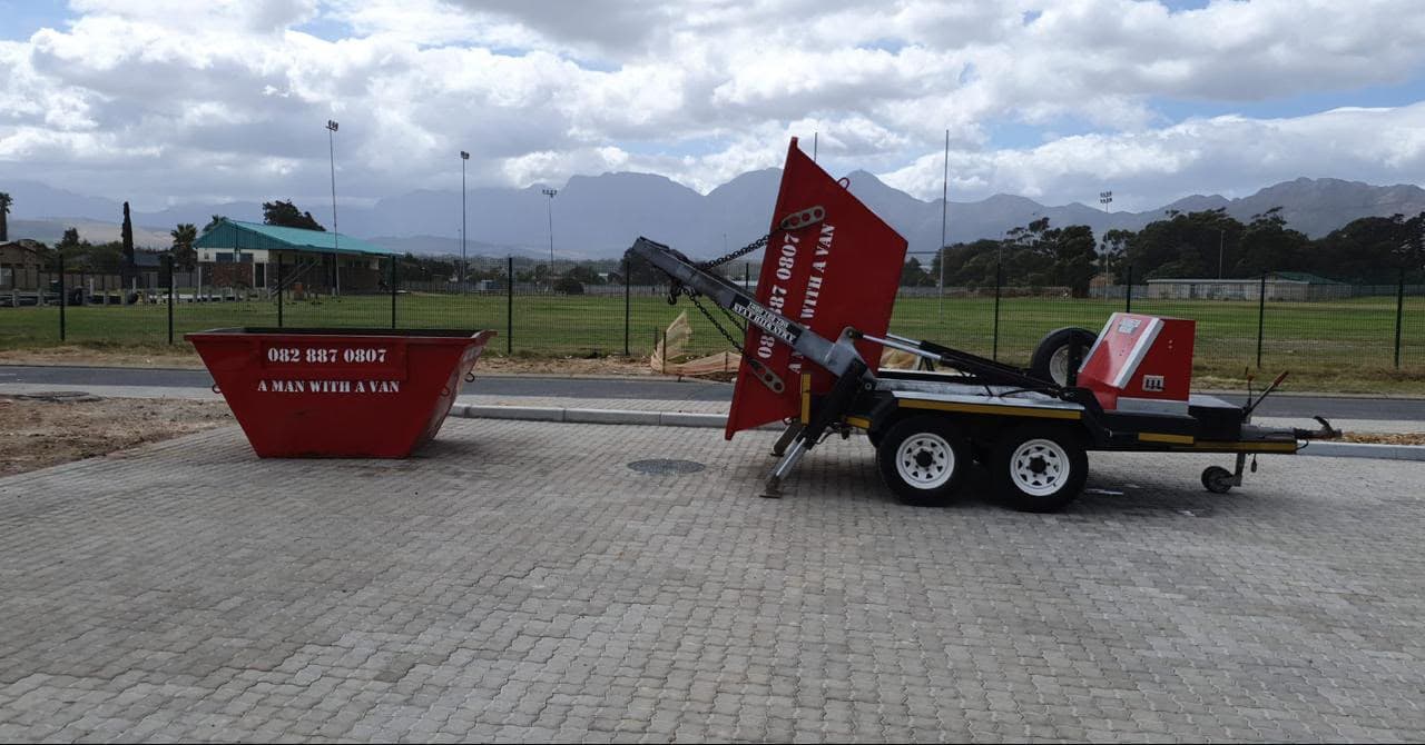 A Man With A Van branded skip and skip-loader trailer